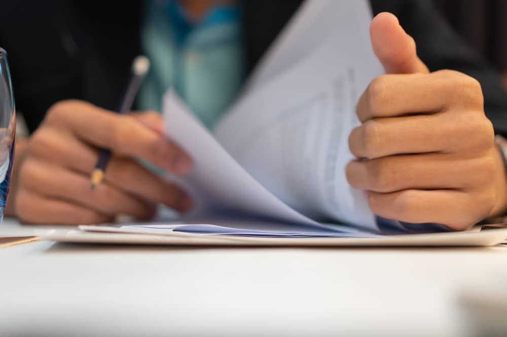 Medical professional looking at BMO doctor loan paperwork