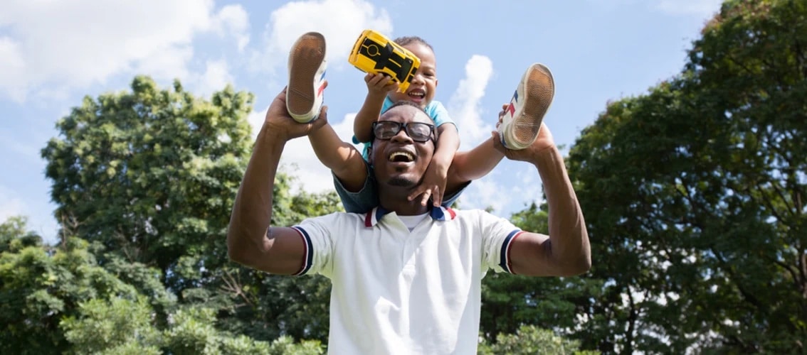 Physician and son enjoying park outside