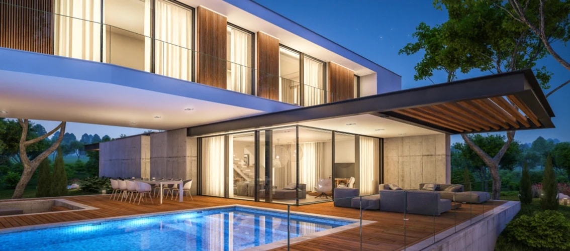 two story modern home made of glass, stone, and wood