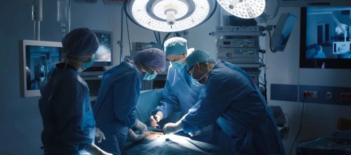 group of surgeons performing surgery