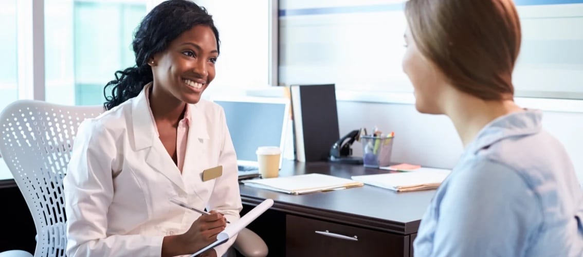 Doctor and patient talk in an office