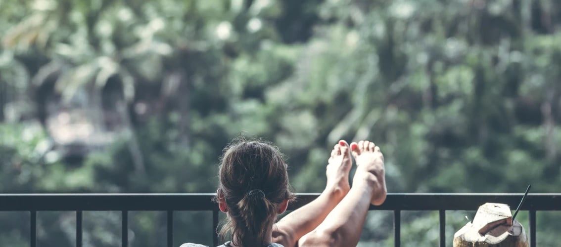 A physician on sabbatical puts her feet up.