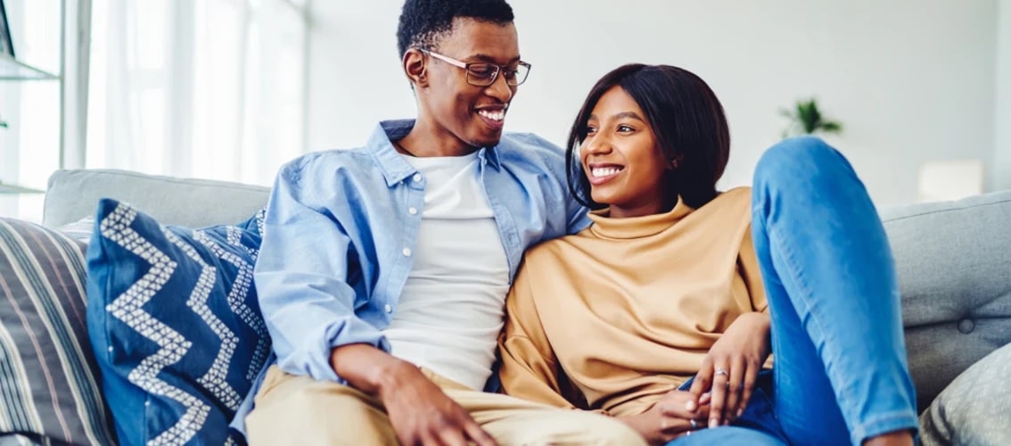 Young happy couple on a couch