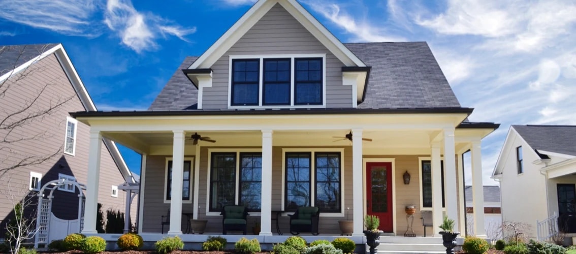 two story home with red door