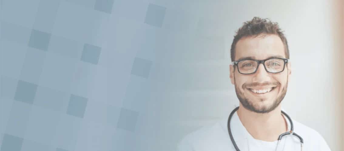 Male physician smiling at camera
