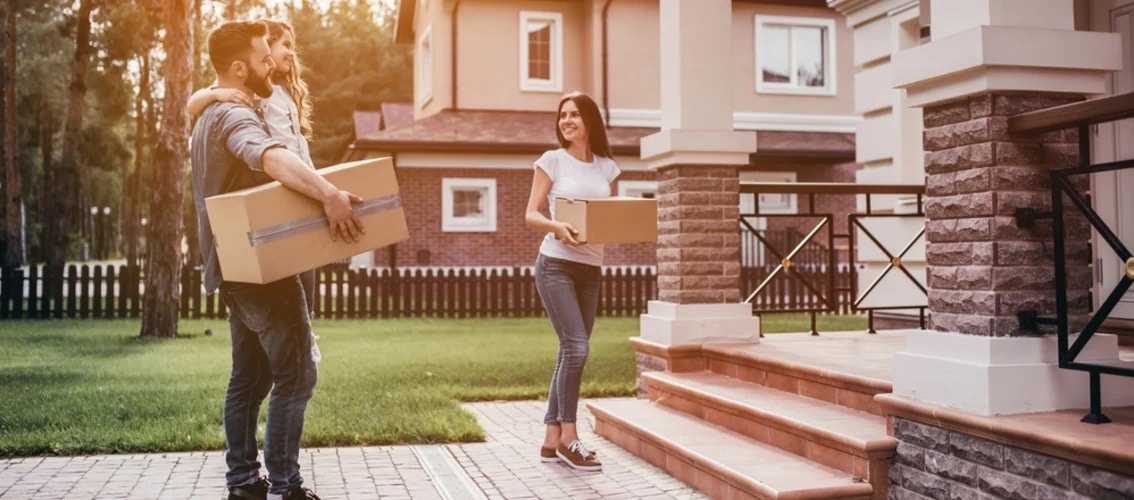 happy family moving in to new home
