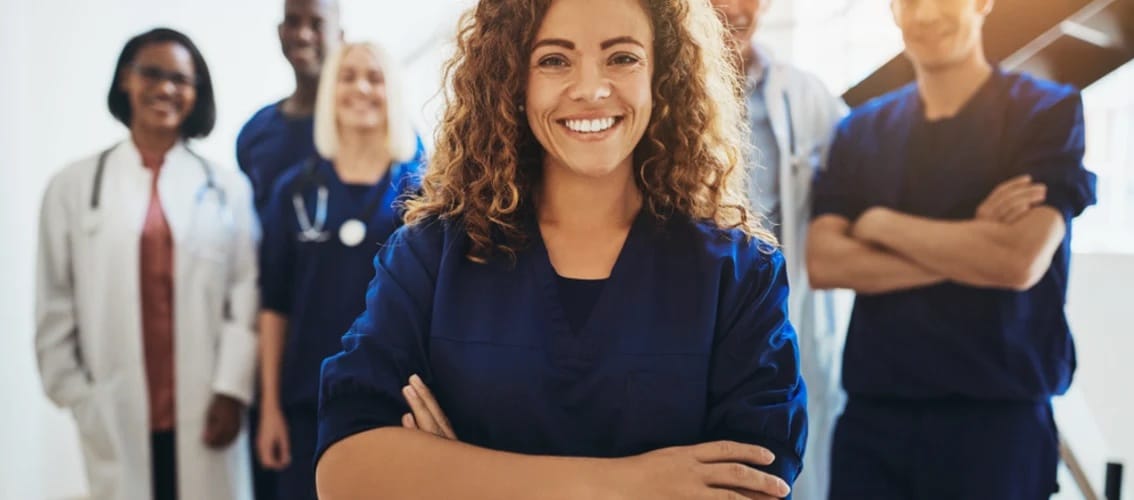 mixed group of smiling male and female medical professionals