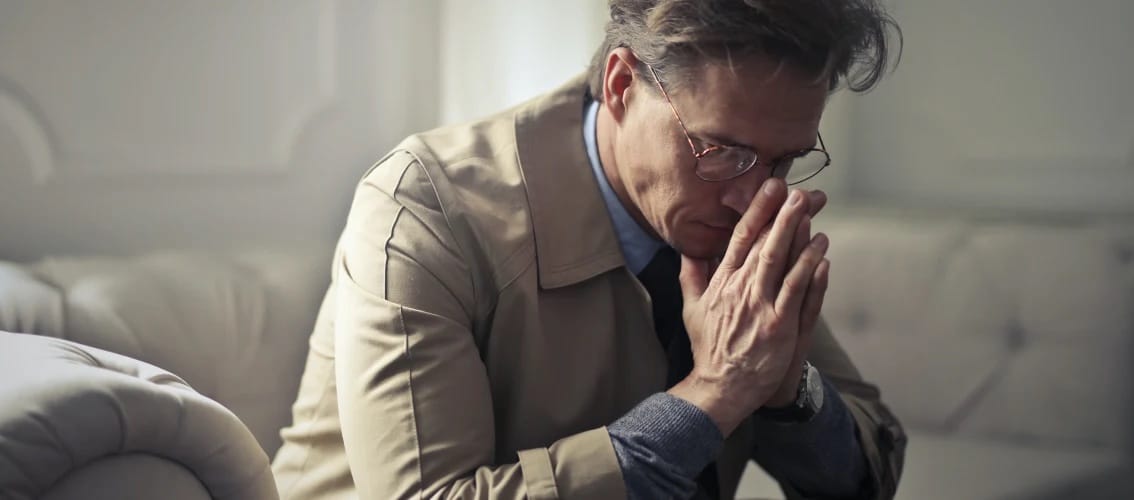 Male physician looks very stressed.