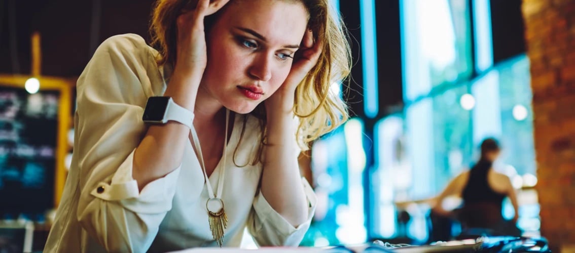 Woman reviewing SoFi student loan refinancing options