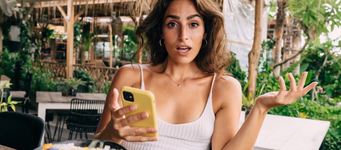 A female doctor get surprising news on her phone