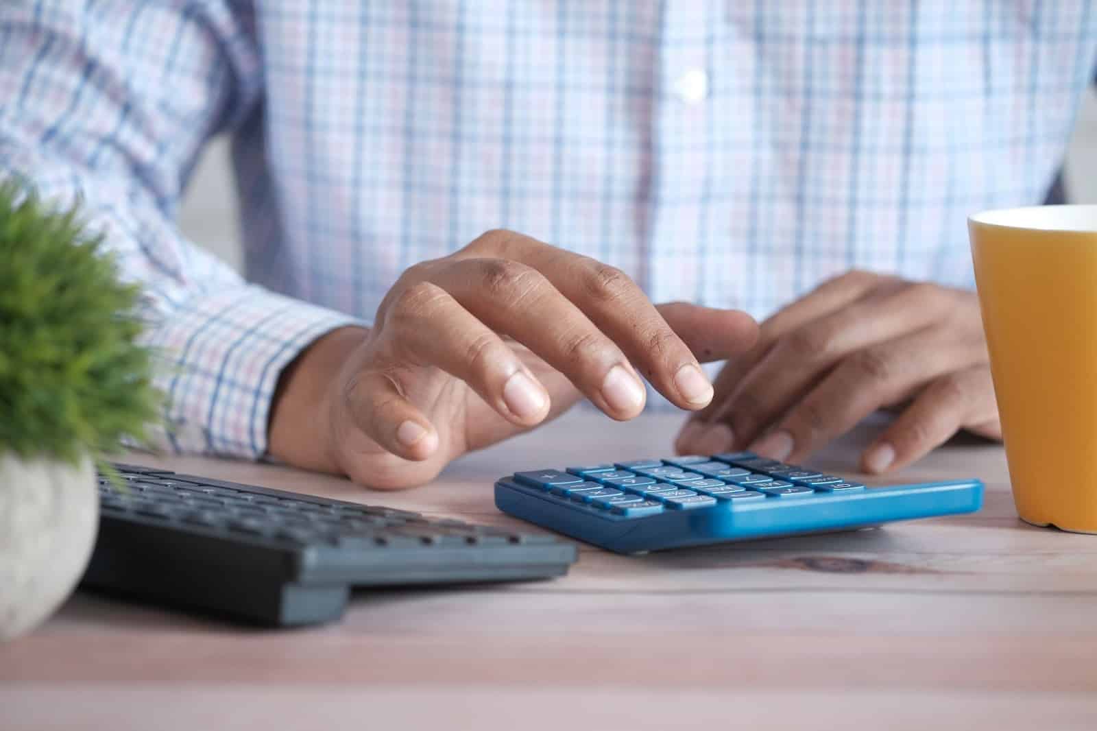 Physician calculating costs of disability insurance