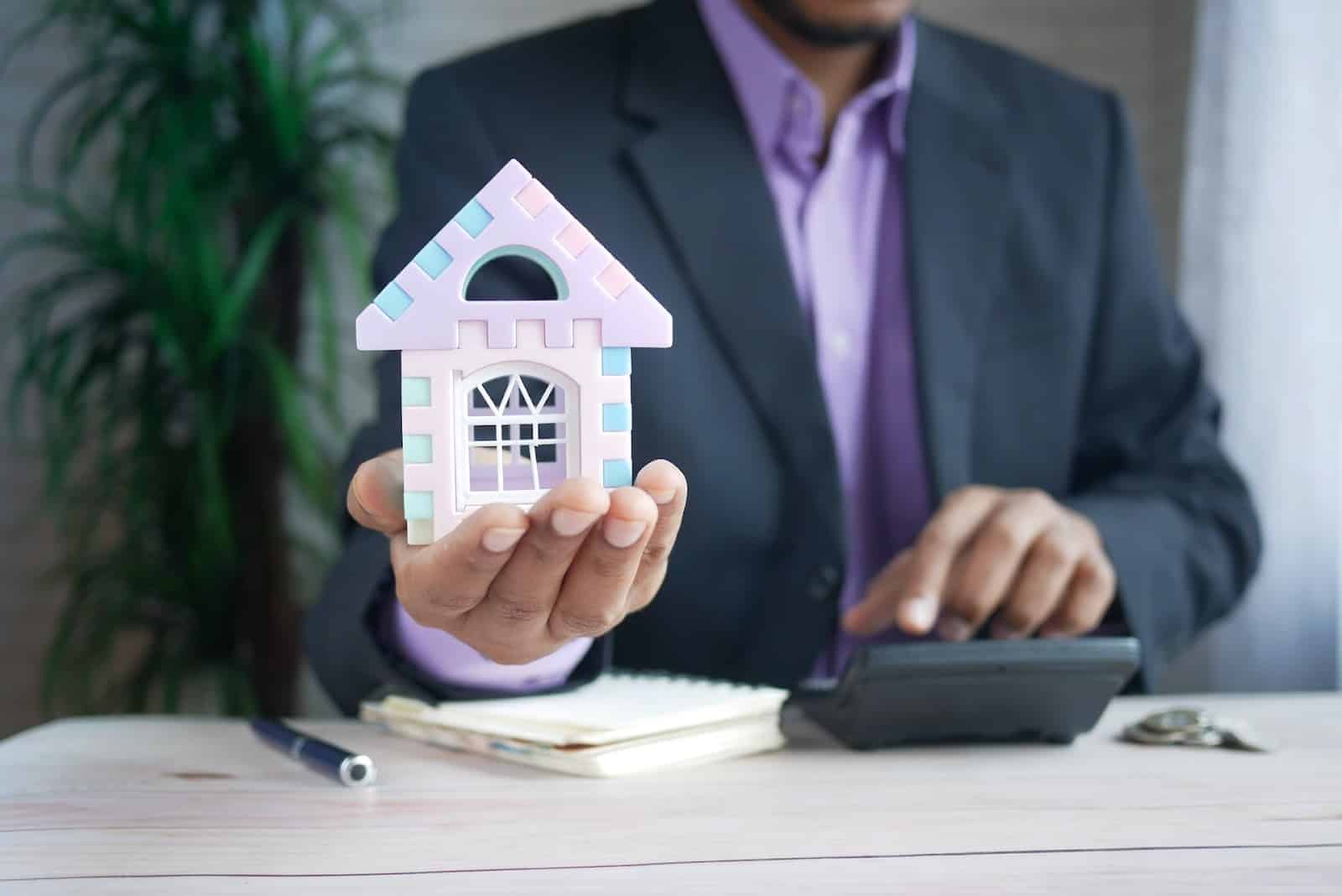 A physician mortgage lender holds a small model house