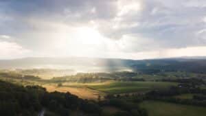 View of the sun breaking over a valley in Virginia.