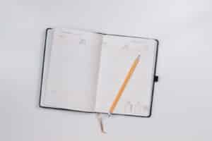 Picture of a notebook and pencil