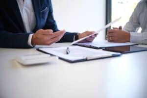 two male physicians discuss disability insurance