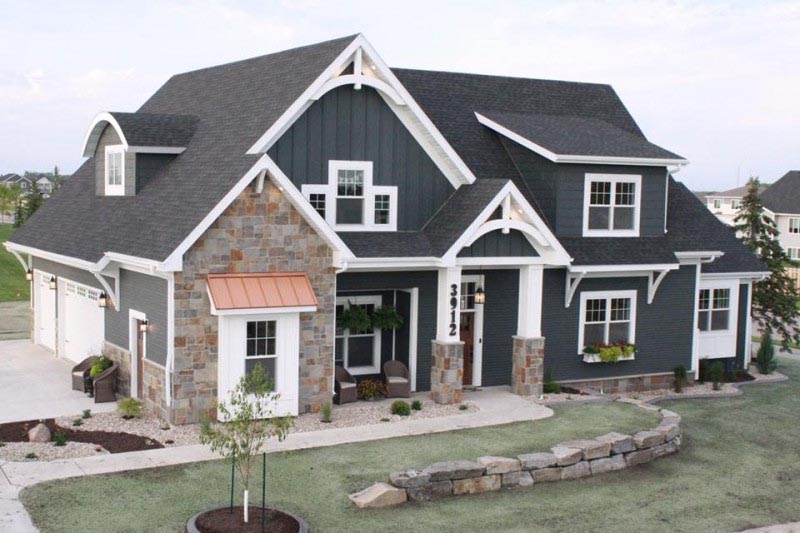 North Dakota home made of siding and stone.