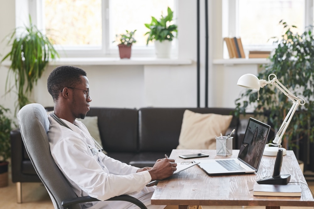 young doctor working on a laptop