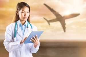 Traveling doctor with an airplane traveling behind her